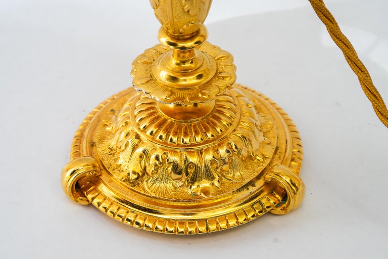 Historistic fire gilted table lamp with fabric shade vienna around 1890s