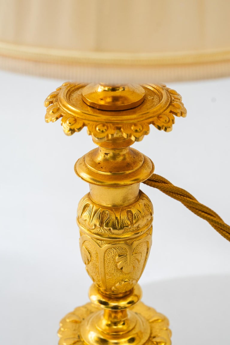 Historistic fire gilted table lamp with fabric shade vienna around 1890s