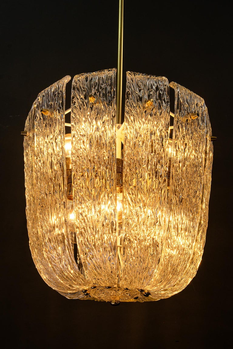 Modern mid century chandelier with brass and curved textured glass by J.T Kalmar