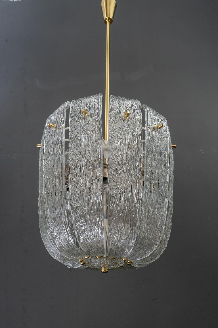 Modern mid century chandelier with brass and curved textured glass by J.T Kalmar