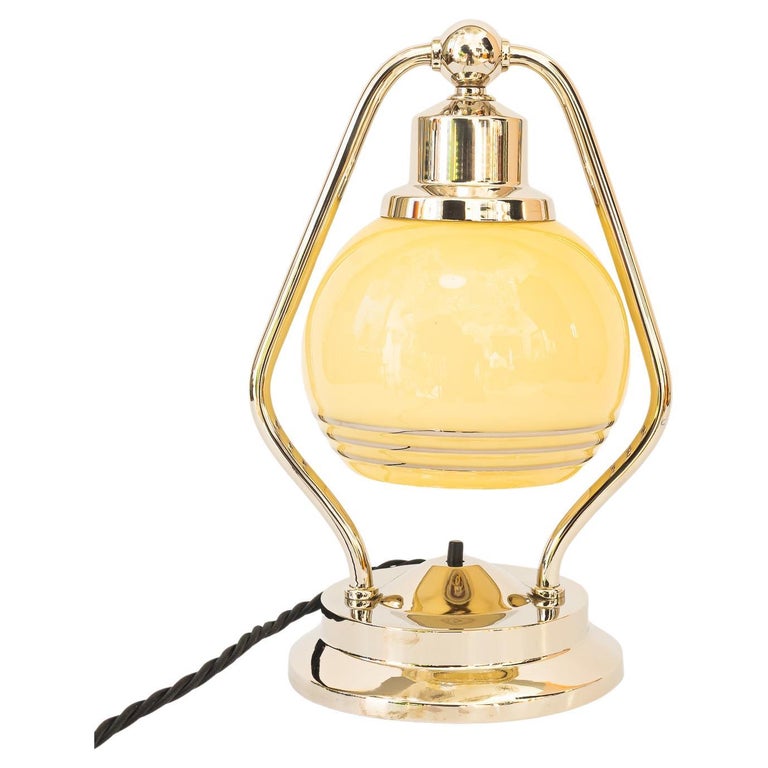 Swiveling Art Deco nickel table lamp with glass vienna around 1920s