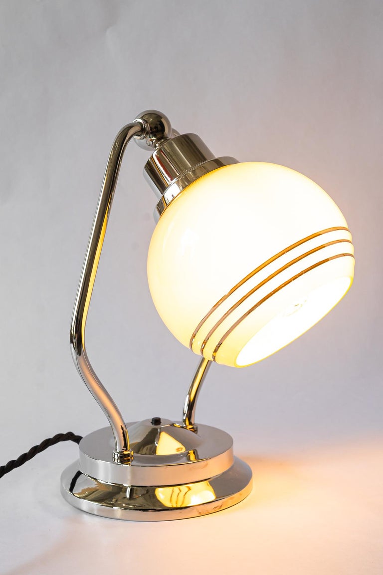 Swiveling Art Deco nickel table lamp with glass vienna around 1920s