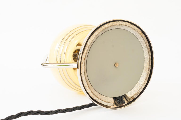 Swiveling Art Deco nickel table lamp with glass vienna around 1920s