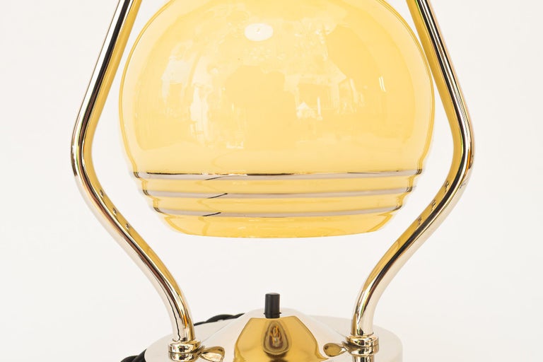 Swiveling Art Deco nickel table lamp with glass vienna around 1920s