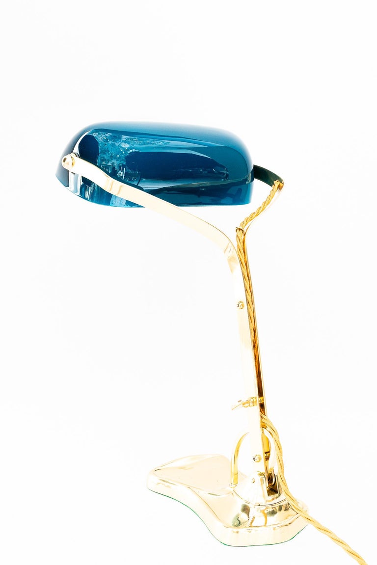 Swiveling Art Deco banker table lamp with glass shade around 1920s