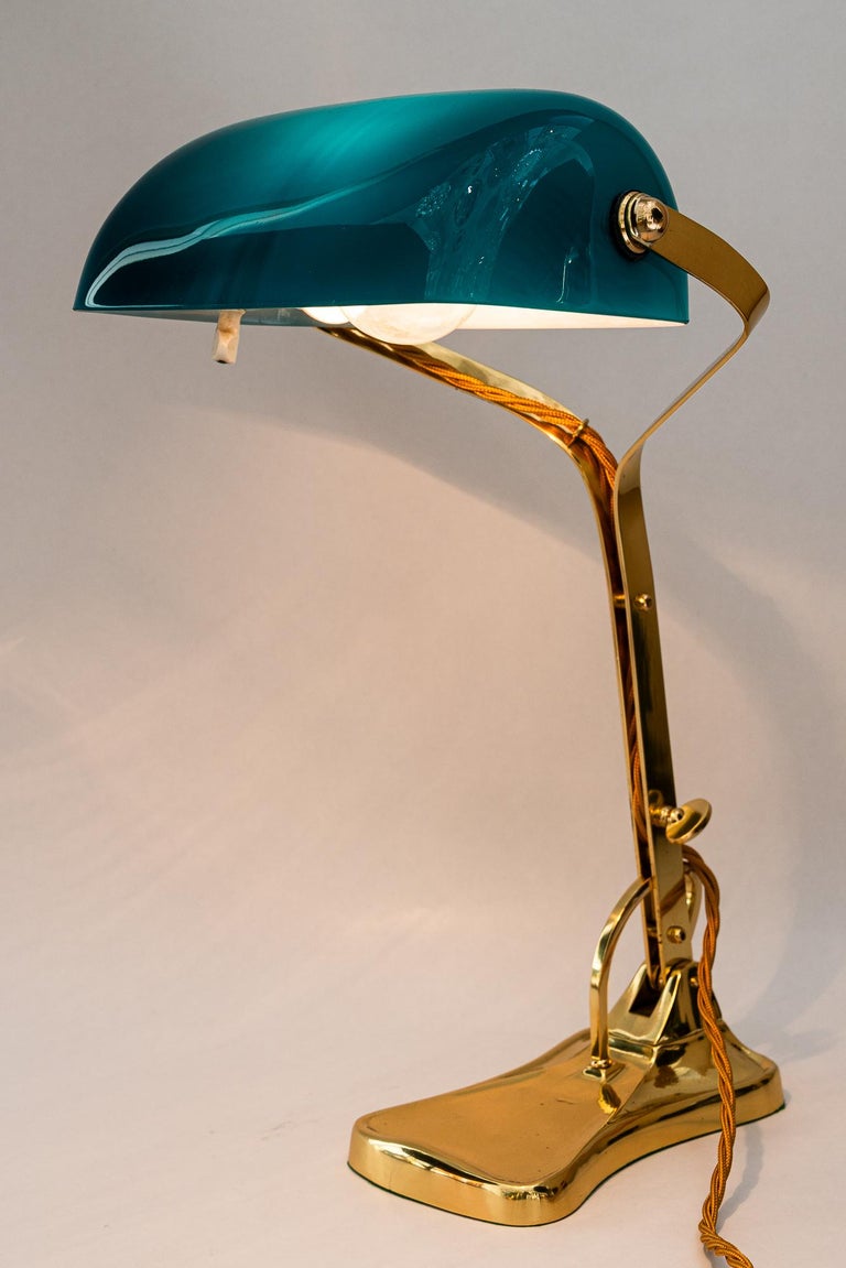 Swiveling Art Deco banker table lamp with glass shade around 1920s