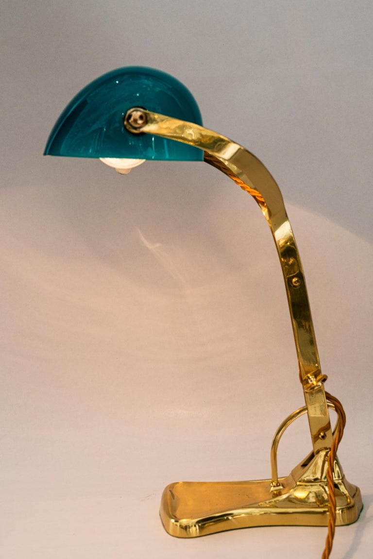 Swiveling Art Deco banker table lamp with glass shade around 1920s