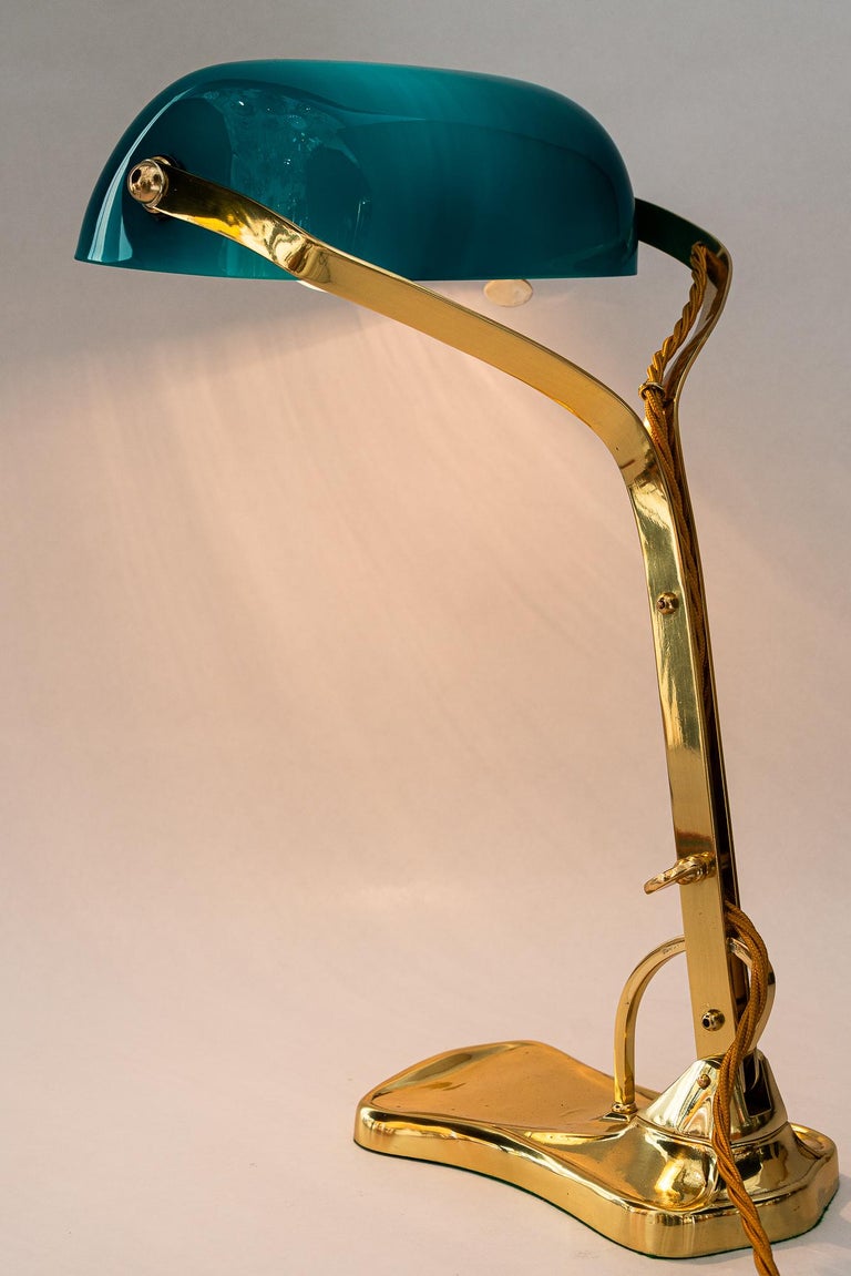 Swiveling Art Deco banker table lamp with glass shade around 1920s