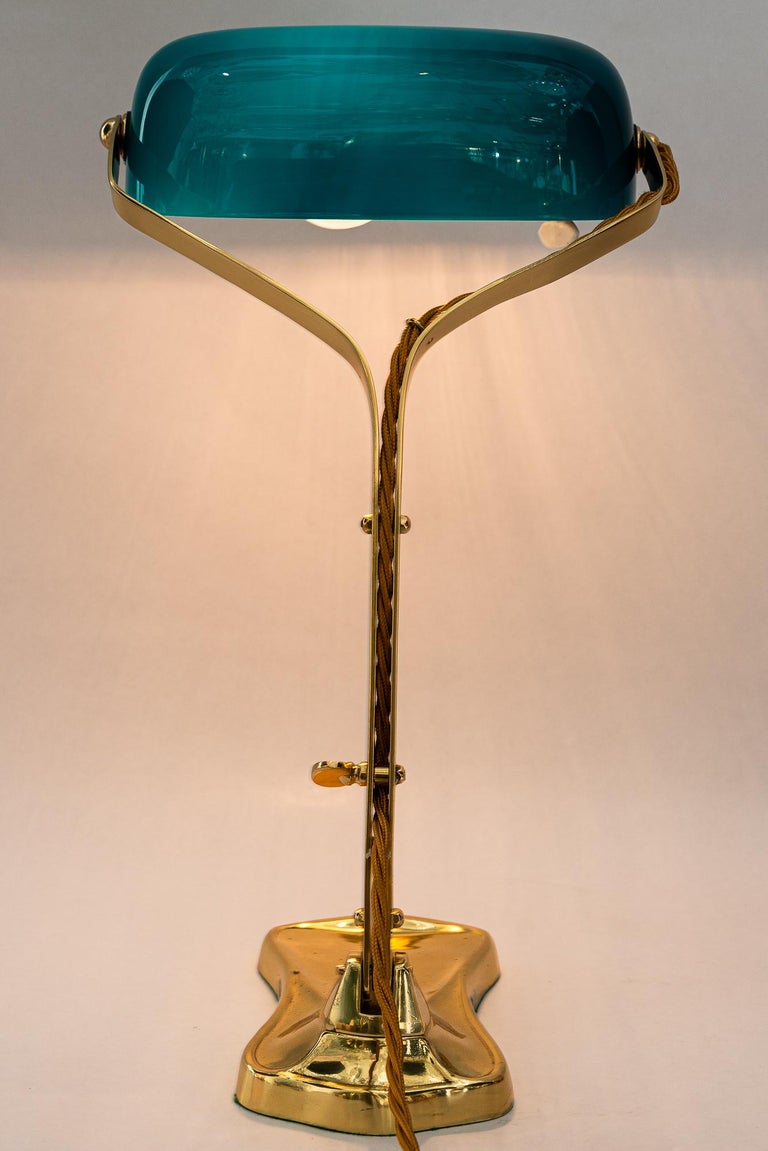 Swiveling Art Deco banker table lamp with glass shade around 1920s