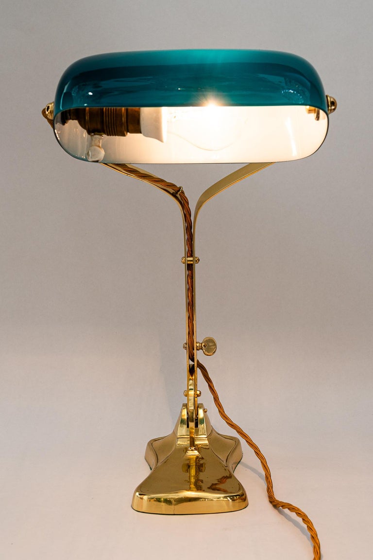 Swiveling Art Deco banker table lamp with glass shade around 1920s
