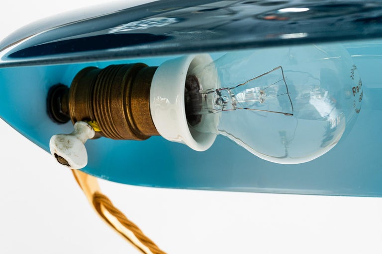 Swiveling Art Deco banker table lamp with glass shade around 1920s