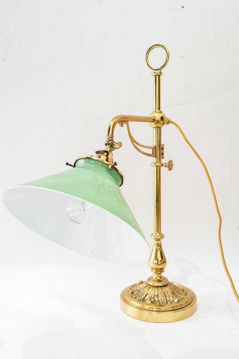 Swiveling and hight adjustable art deco table lamp with original opal glass 1920