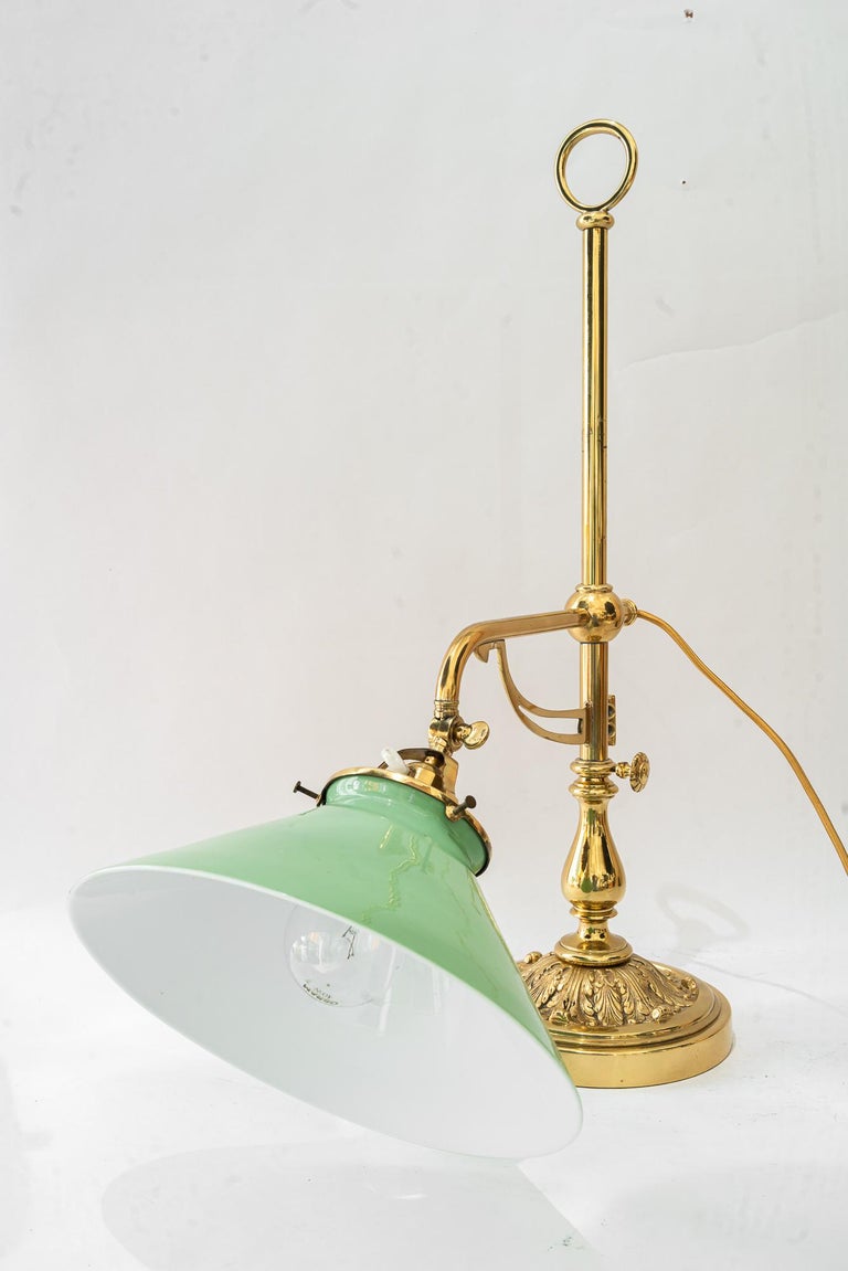 Swiveling and hight adjustable art deco table lamp with original opal glass 1920