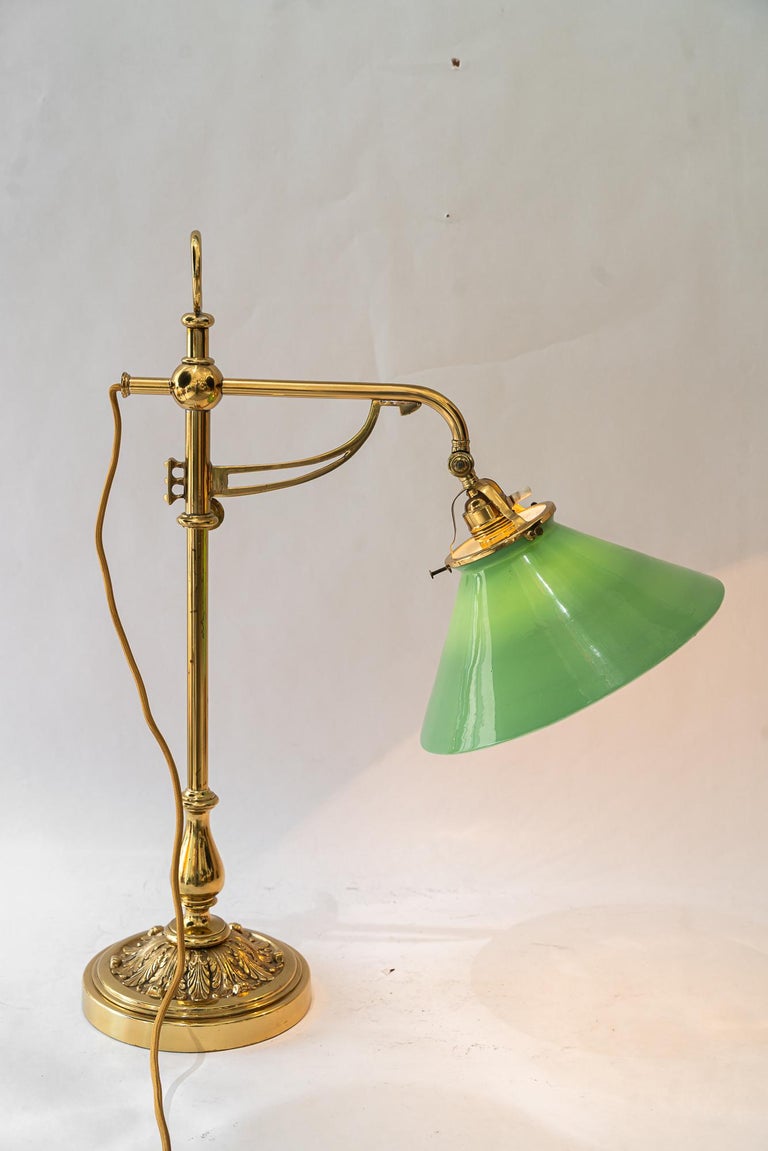Swiveling and hight adjustable art deco table lamp with original opal glass 1920