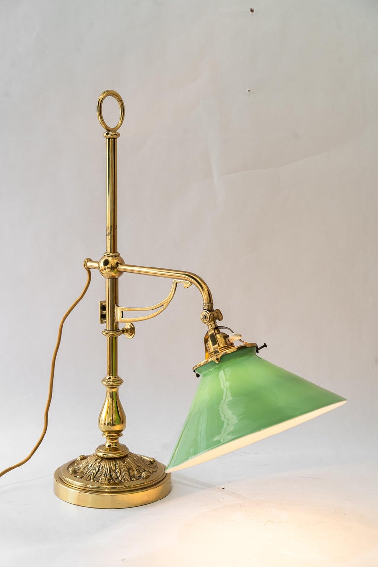 Swiveling and hight adjustable art deco table lamp with original opal glass 1920
