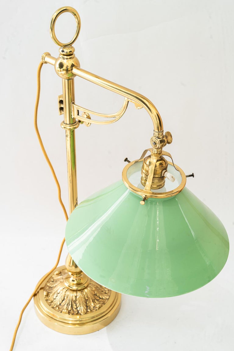 Swiveling and hight adjustable art deco table lamp with original opal glass 1920