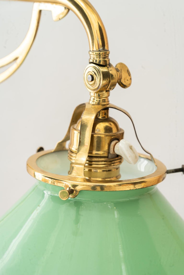 Swiveling and hight adjustable art deco table lamp with original opal glass 1920