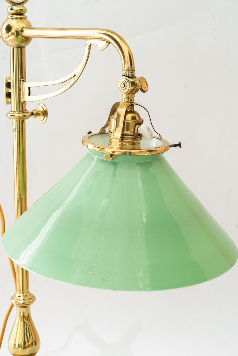 Swiveling and hight adjustable art deco table lamp with original opal glass 1920