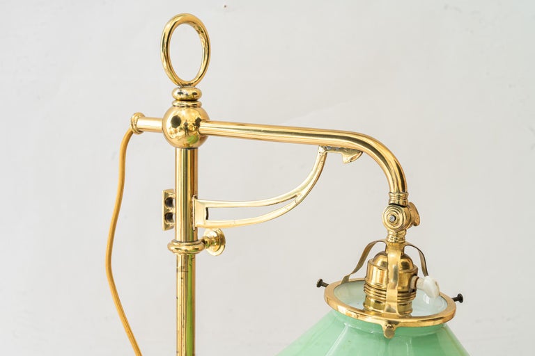 Swiveling and hight adjustable art deco table lamp with original opal glass 1920