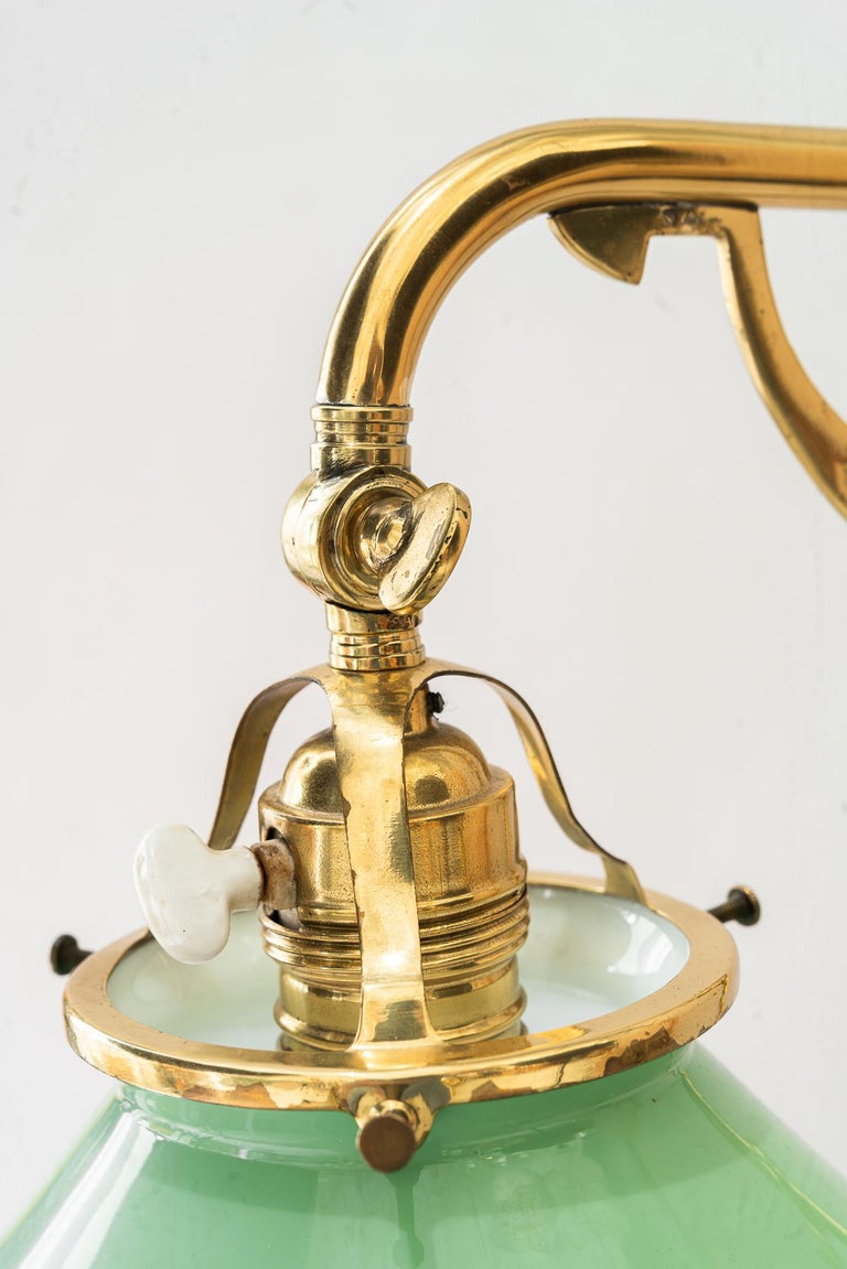 Swiveling and hight adjustable art deco table lamp with original opal glass 1920