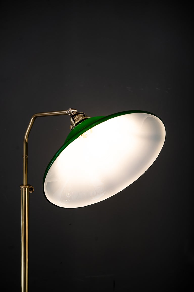 Adjustable Art Deco floor lamp with original green shade vienna around 1920s